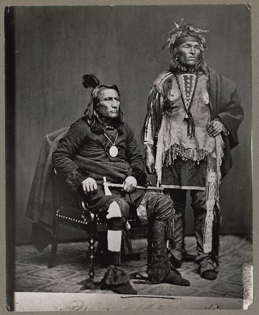 Mid-19th-century photo of Chief Crane, Potawatomi, holding tomahawk and unidentified Native American man in delegation to Washington